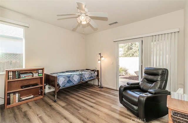 bedroom with access to outside, ceiling fan, and light hardwood / wood-style flooring