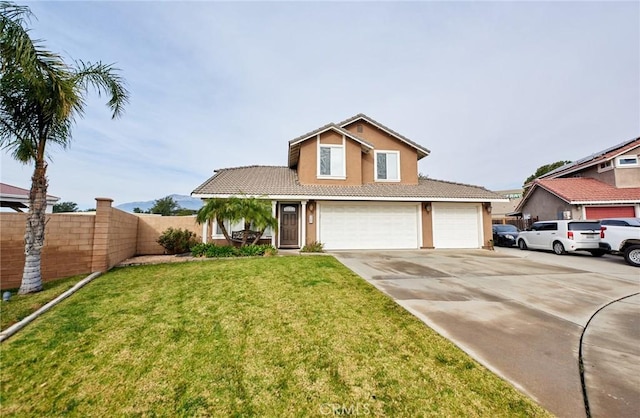 view of front of house featuring a garage and a front lawn