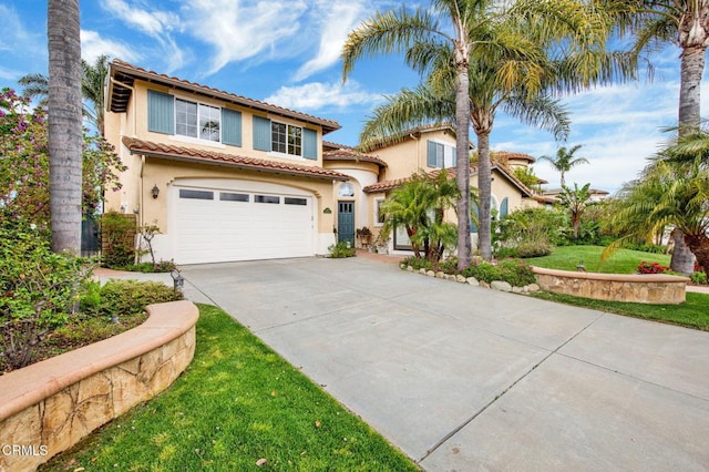 mediterranean / spanish-style house with a front lawn and a garage