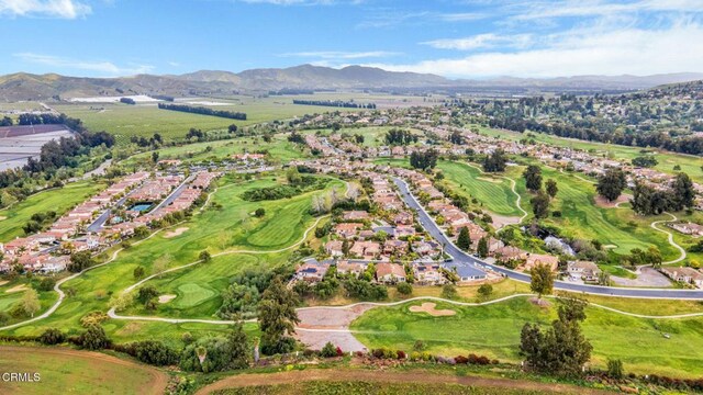 birds eye view of property featuring a mountain view