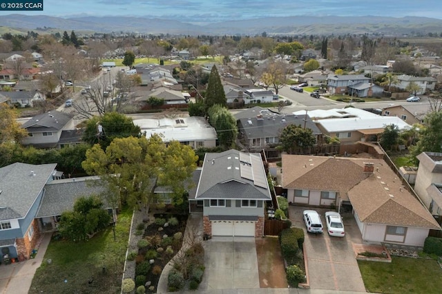 birds eye view of property with a mountain view