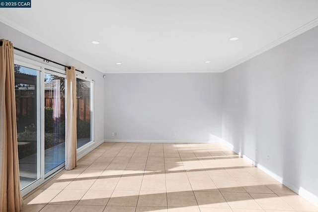 tiled empty room featuring ornamental molding