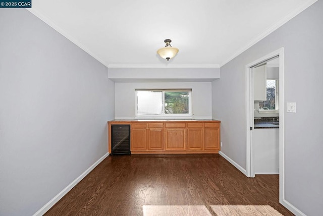 kitchen with dark hardwood / wood-style floors, beverage cooler, and ornamental molding