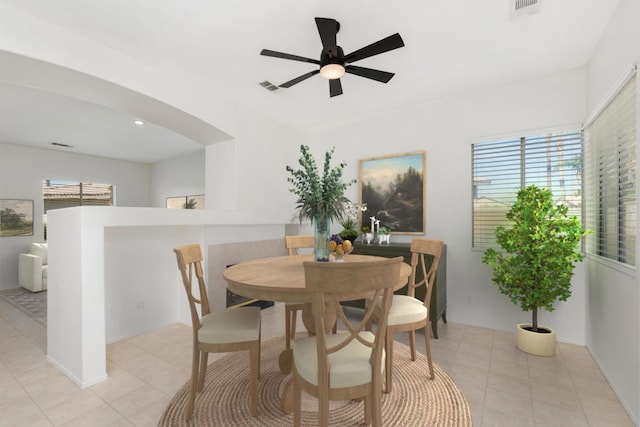 tiled dining room with ceiling fan