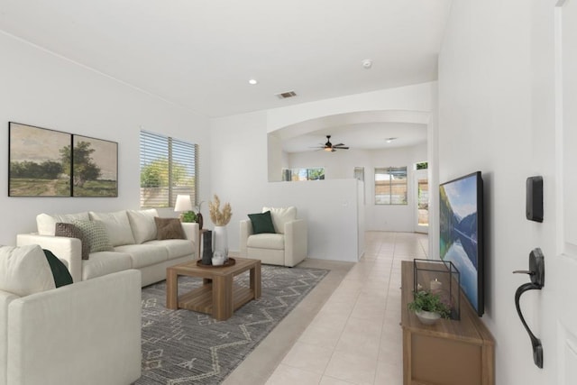 living room with ceiling fan and light tile patterned floors