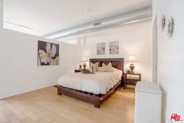 bedroom featuring hardwood / wood-style flooring