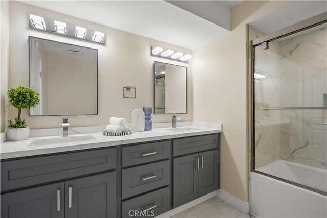 bathroom featuring shower / bath combination with glass door and vanity