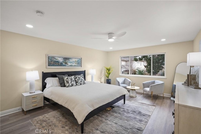 bedroom with dark wood-type flooring and ceiling fan