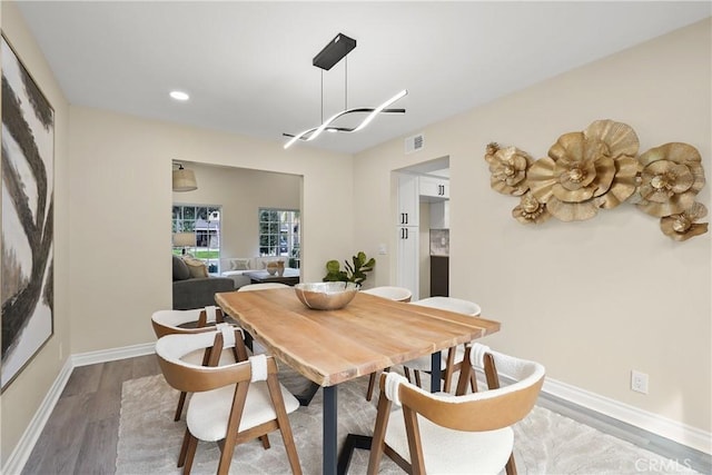 dining area featuring hardwood / wood-style flooring