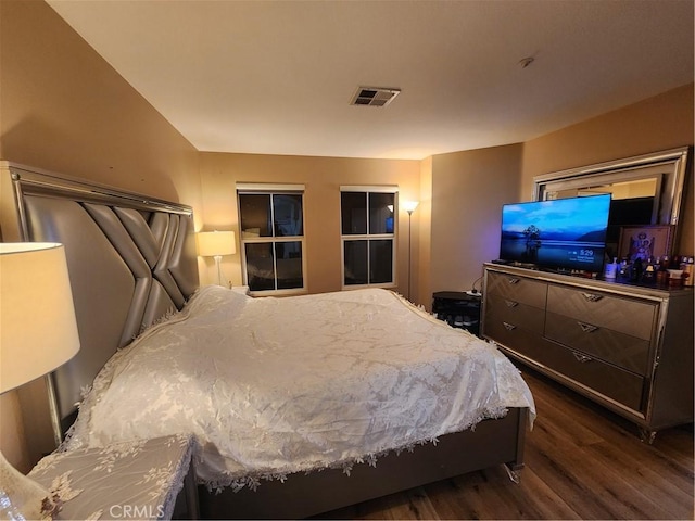 bedroom featuring dark hardwood / wood-style flooring