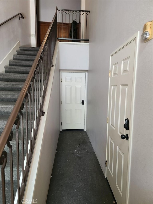 stairway featuring concrete floors