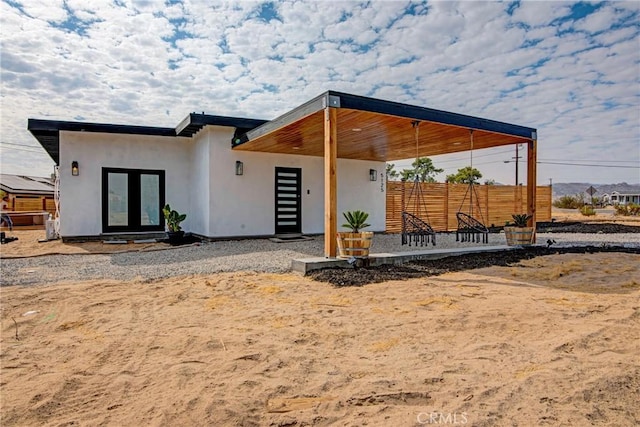 back of property featuring french doors