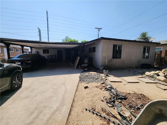 view of front of property with a carport