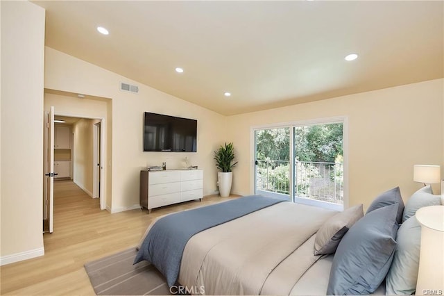 bedroom featuring vaulted ceiling and light hardwood / wood-style flooring