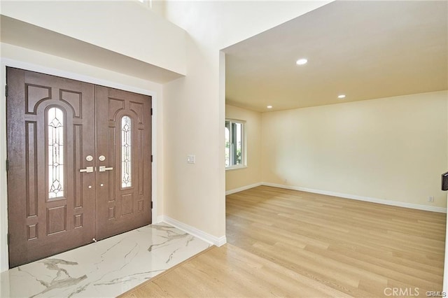 entryway with light hardwood / wood-style flooring