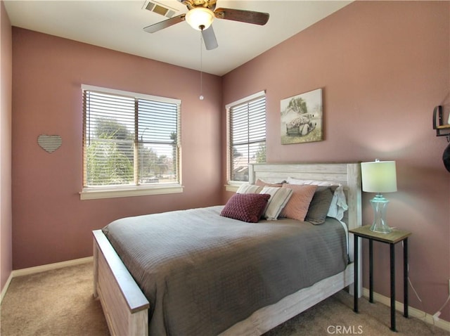 bedroom featuring ceiling fan and light colored carpet