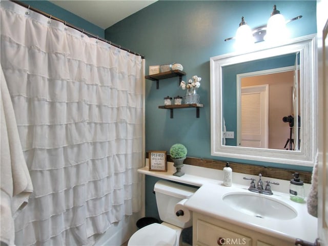 bathroom with toilet and vanity