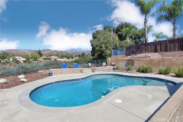 view of swimming pool featuring a mountain view