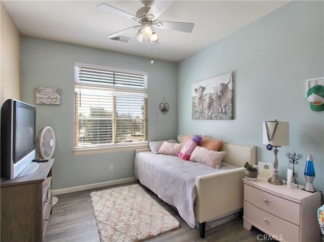 bedroom featuring ceiling fan and hardwood / wood-style floors