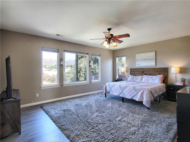 bedroom featuring ceiling fan and dark hardwood / wood-style flooring