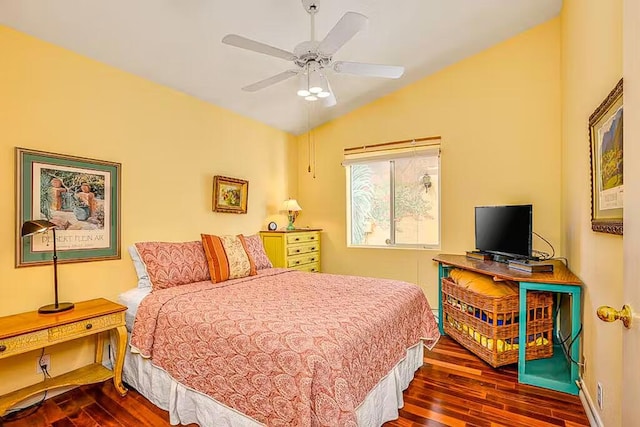 bedroom with ceiling fan, dark hardwood / wood-style flooring, and lofted ceiling