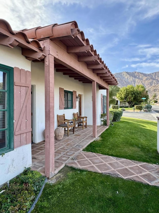 view of patio / terrace featuring a mountain view