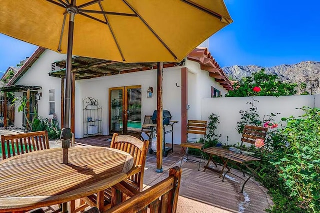 view of patio / terrace featuring a deck with mountain view