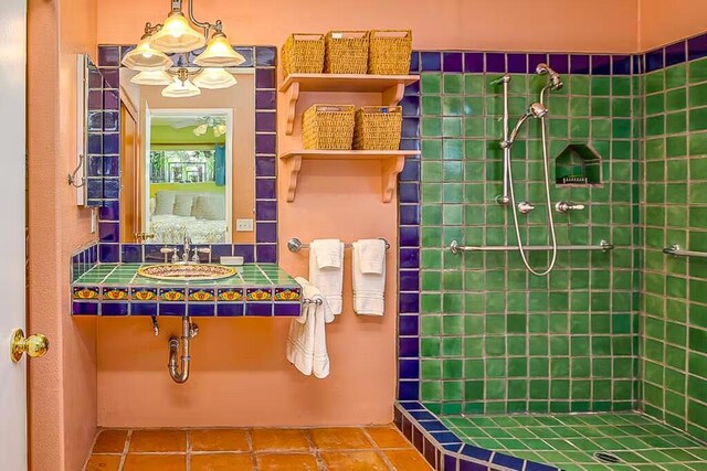 bathroom featuring a shower, tile patterned floors, and sink