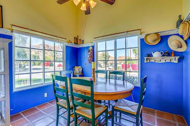 tiled dining room with ceiling fan