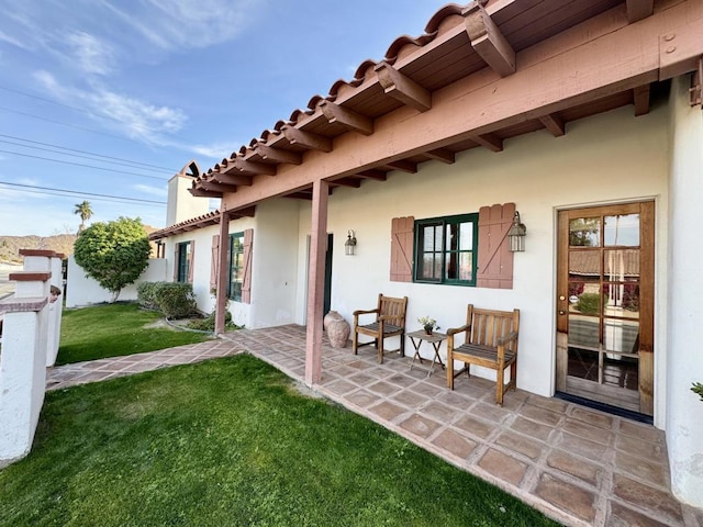 view of front of property with a front yard, a mountain view, and a garage