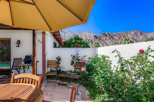 view of patio / terrace featuring a mountain view