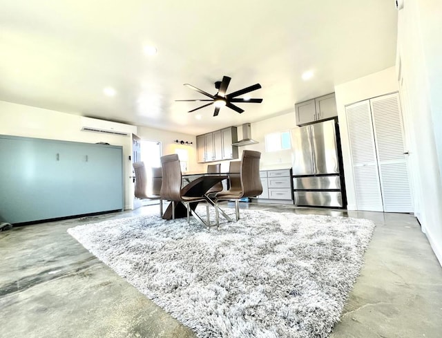 living area featuring ceiling fan and an AC wall unit