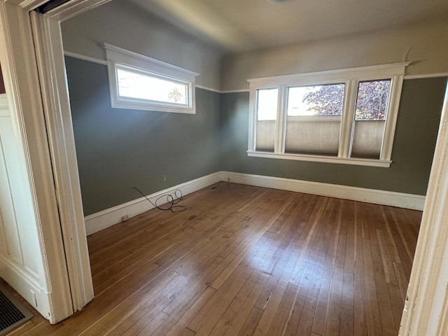 empty room featuring wood-type flooring