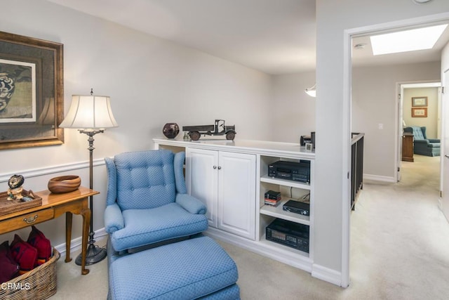 living area with light colored carpet