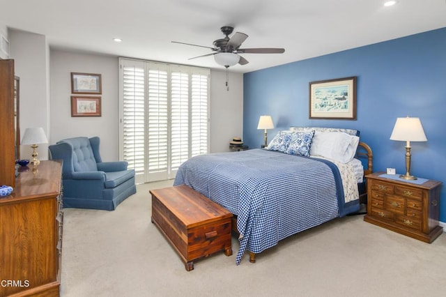 bedroom featuring ceiling fan and light colored carpet