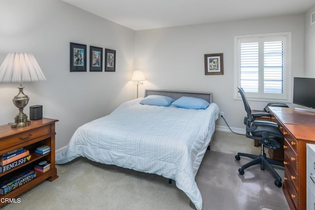 bedroom with light carpet