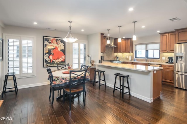 dining area with sink and dark hardwood / wood-style floors