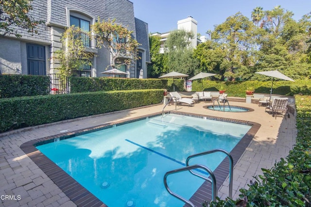 view of pool featuring a patio