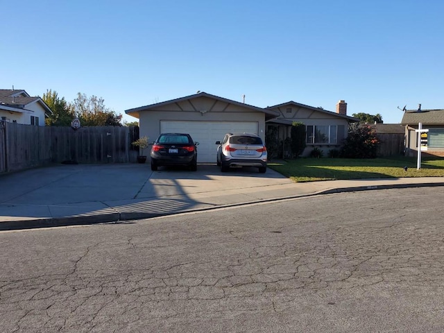 view of front facade with a front lawn and a garage