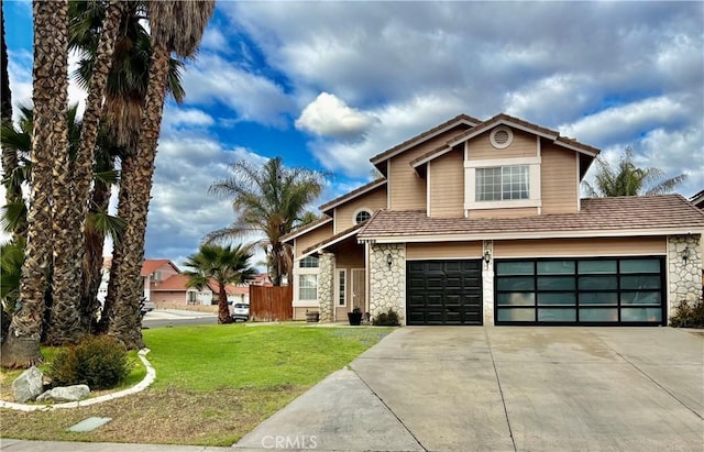 front of property featuring a garage and a front lawn