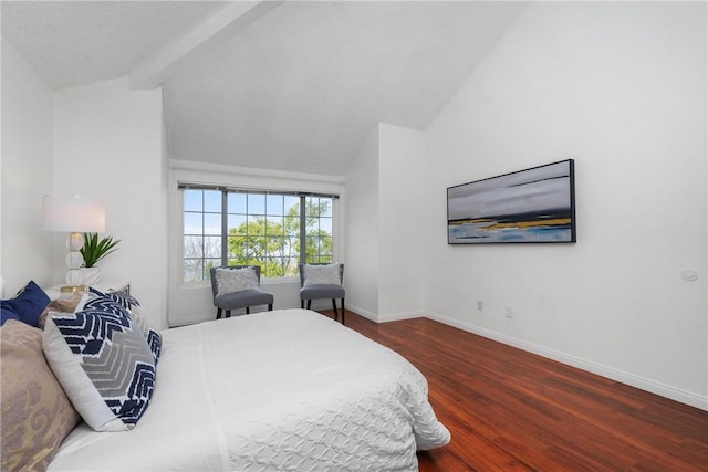 bedroom with dark hardwood / wood-style flooring and lofted ceiling with beams