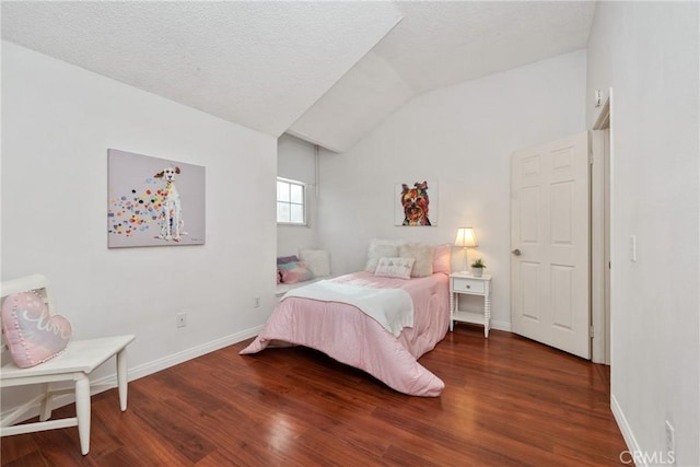 bedroom featuring vaulted ceiling and hardwood / wood-style floors