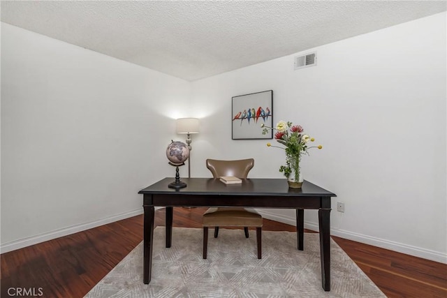 office space featuring hardwood / wood-style floors and a textured ceiling