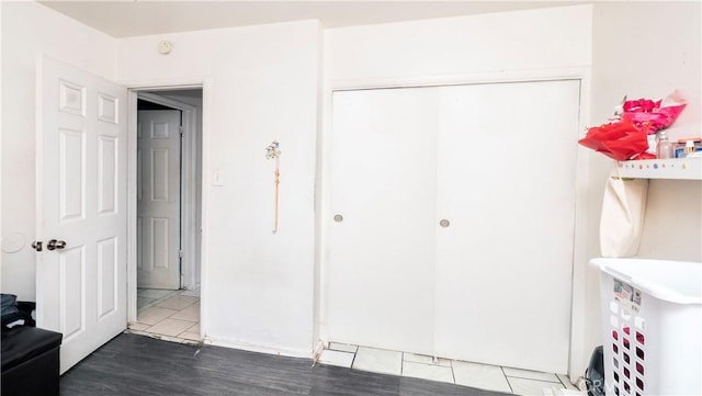 tiled bedroom with a closet