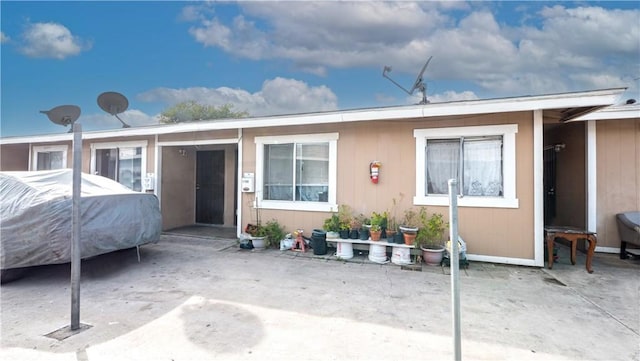 rear view of house with a patio