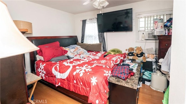 bedroom featuring ceiling fan and hardwood / wood-style floors