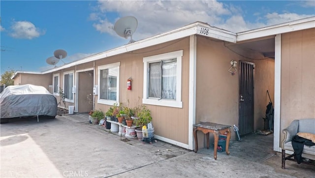 view of side of home featuring a patio