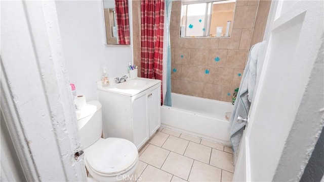 full bathroom featuring toilet, tile patterned floors, vanity, and shower / bathtub combination with curtain