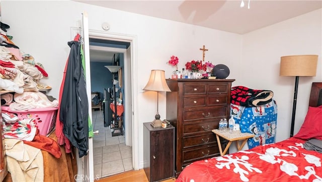 bedroom featuring light tile patterned floors