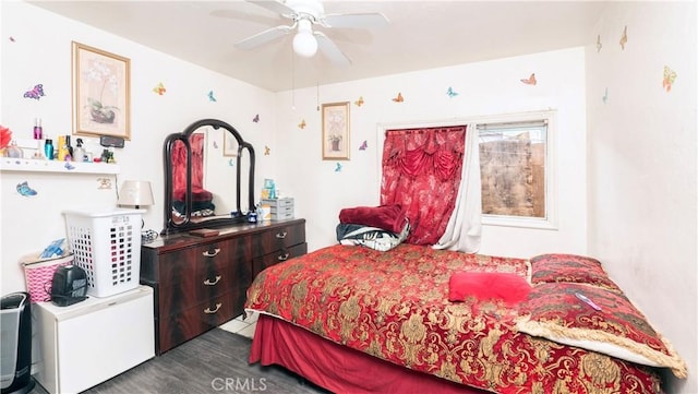 bedroom featuring ceiling fan and dark wood-type flooring